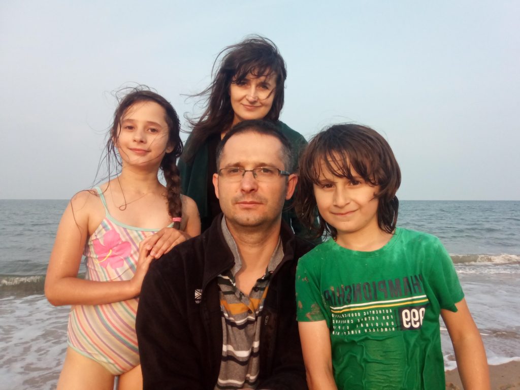 Picture of four people at the sea